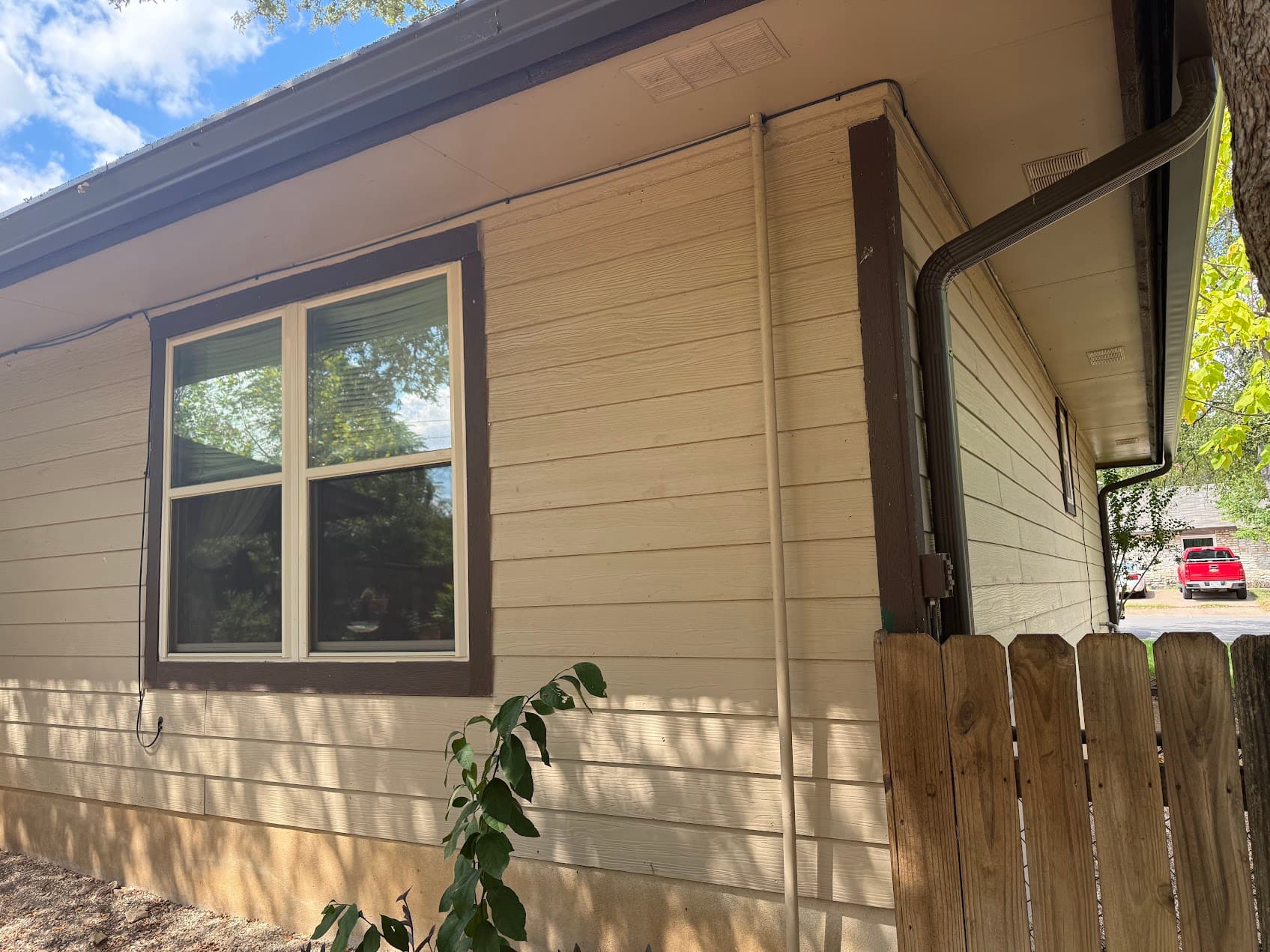 Brown painted home exterior Round Rock Texas