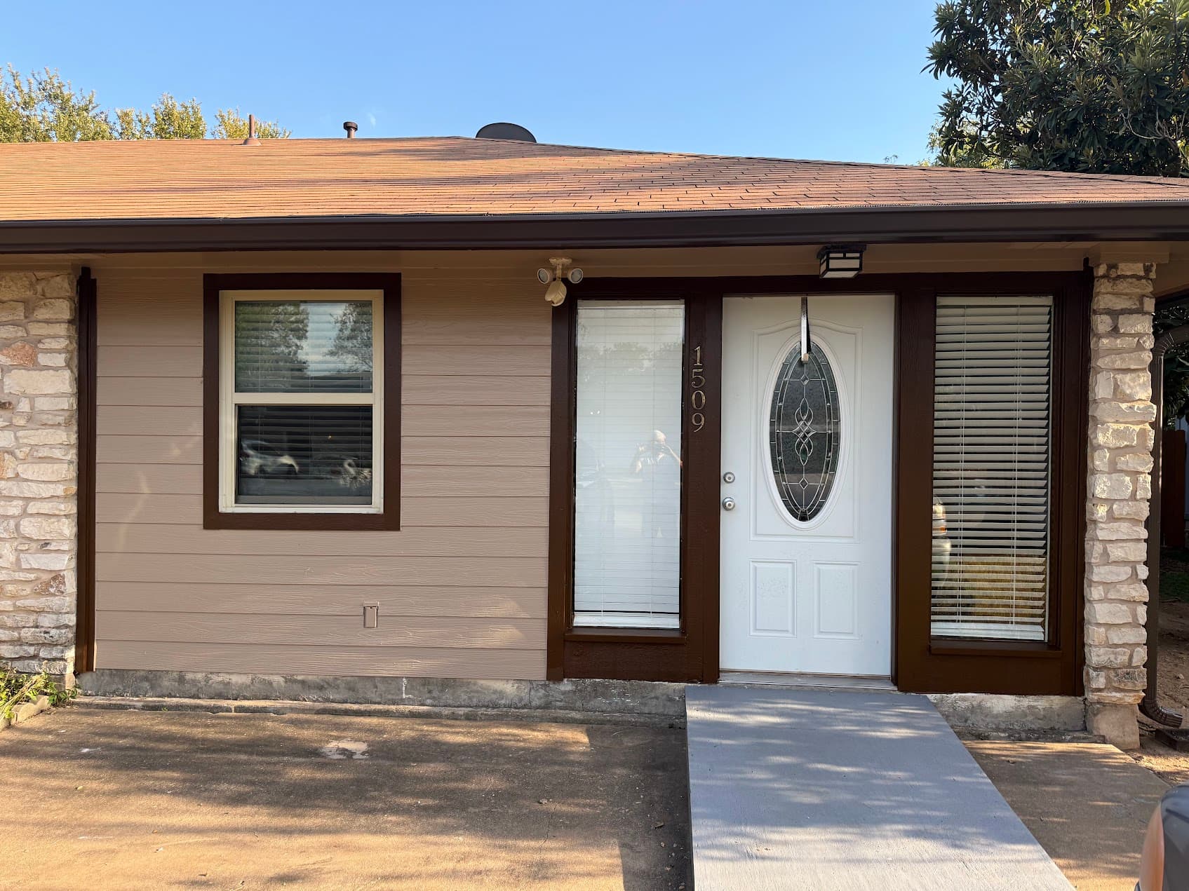 Brown home exterior painting Round Rock TX curb appeal