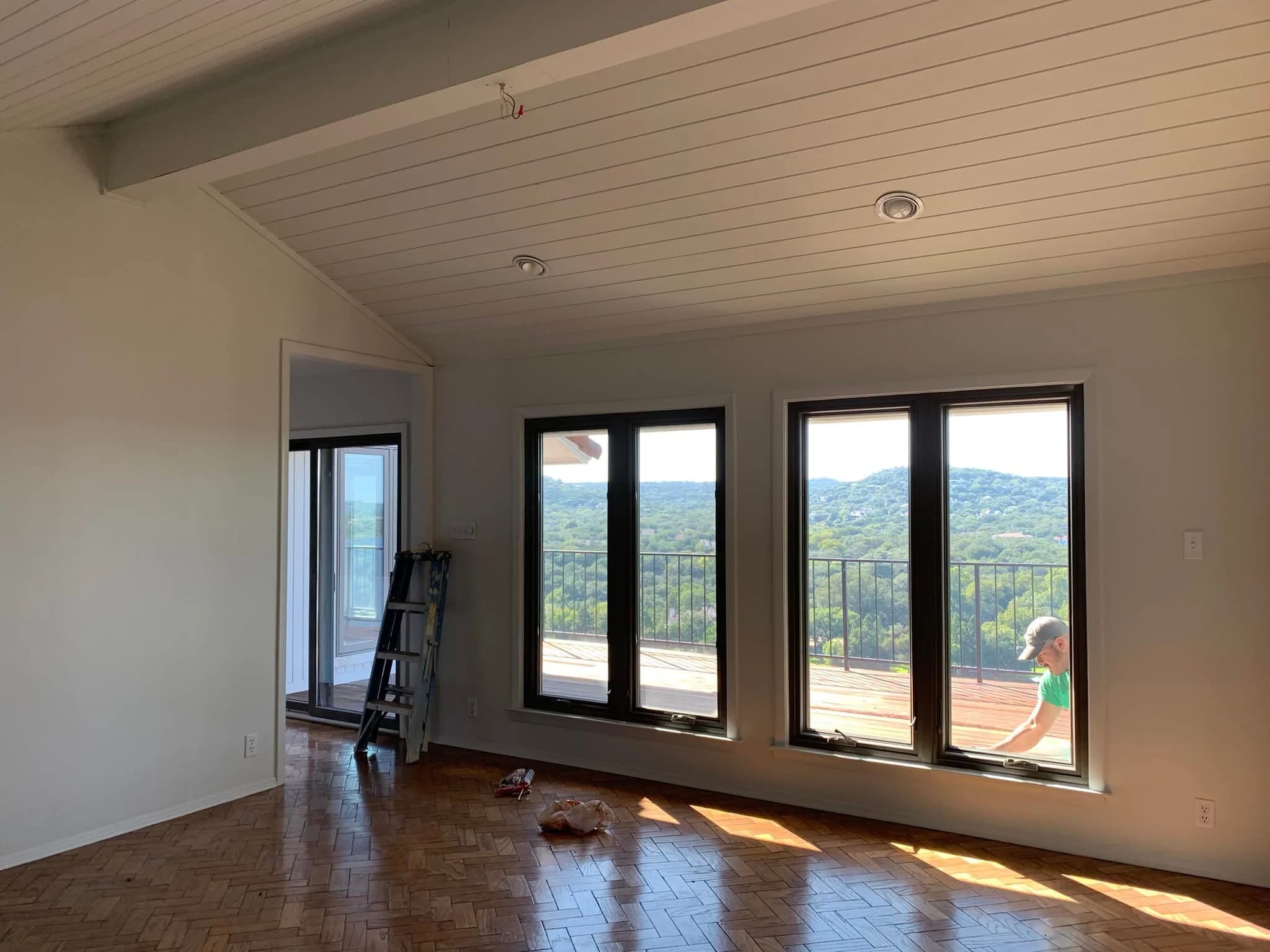 Finished interior paint job — bright open living room with hill country views Austin TX